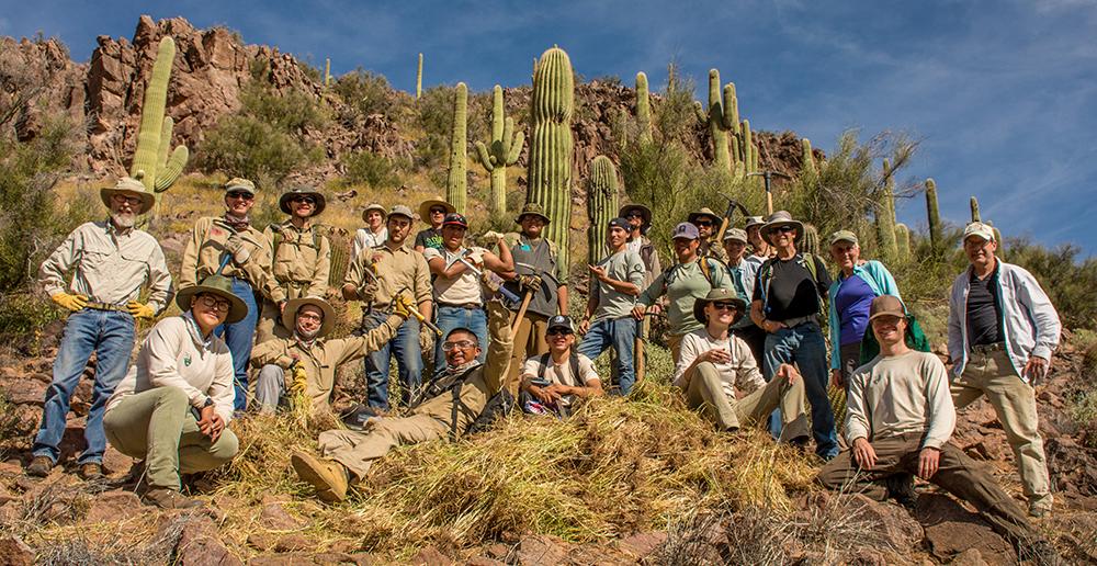 Buffelgrass Pull Volunteers pose with the results of their labors